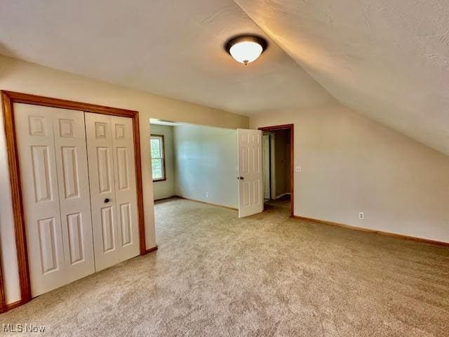 13053 Sarbaugh St SW, Navarre, OH 44662 - bonus room with lofted ceiling, light carpet, and baseboards