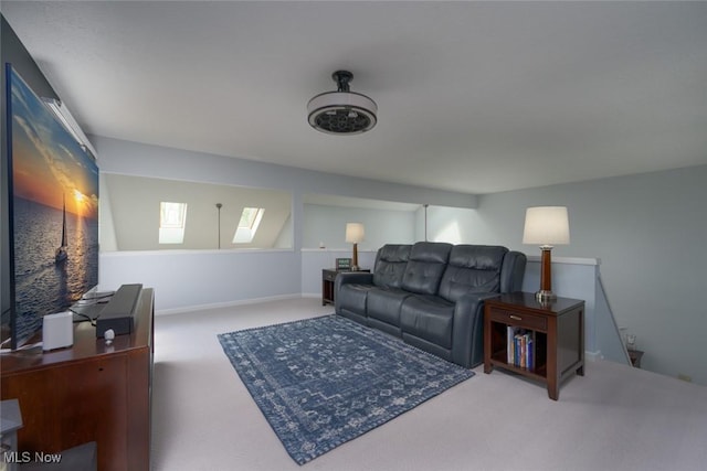 living room with carpet flooring and a skylight