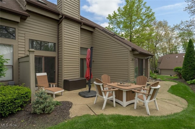 view of patio / terrace with an outdoor fire pit