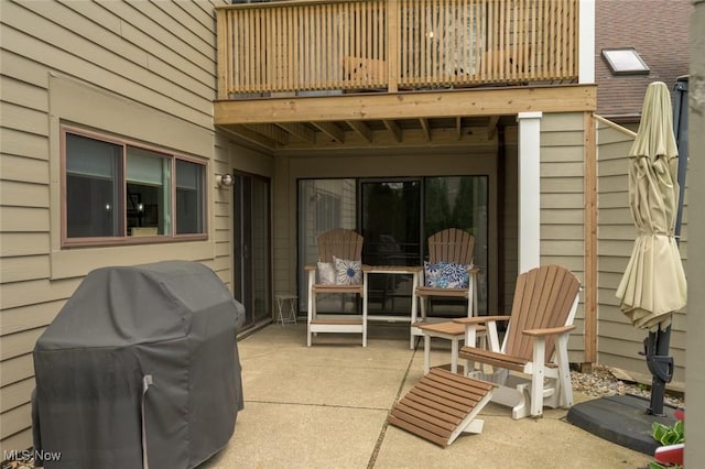 view of patio / terrace with a balcony and area for grilling