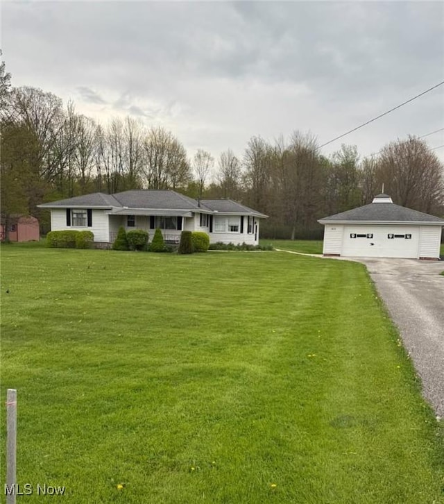 6675 Liberty Rd, Solon, OH 44139 - ranch-style home featuring an outbuilding, a garage, and a front lawn