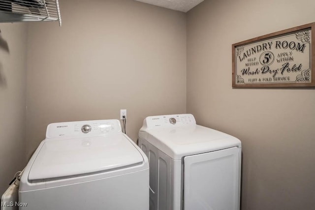 5291 Francesca St NE, Louisville, OH 44641 - clothes washing area with washer and dryer