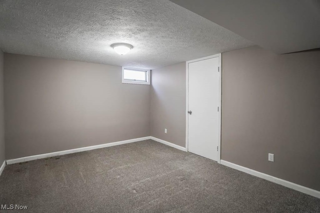 5291 Francesca St NE, Louisville, OH 44641 - basement with carpet flooring, a textured ceiling, and baseboards