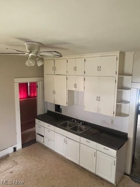 139 Chapman St, Zanesville, OH 43701 - kitchen with open shelves, dark countertops, a sink, and a ceiling fan