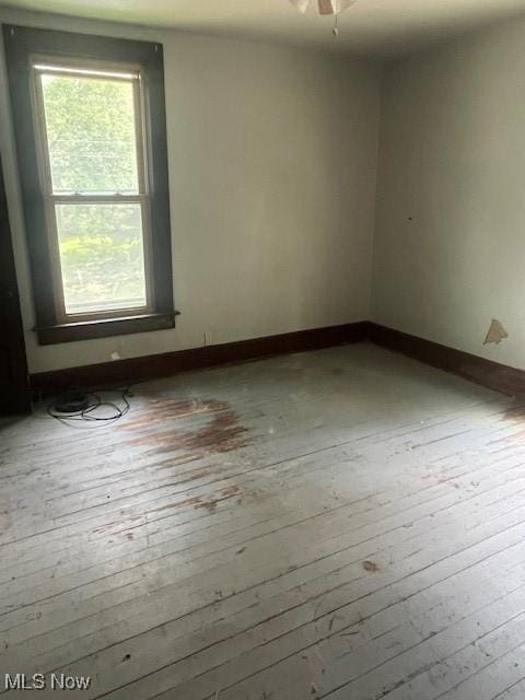 139 Chapman St, Zanesville, OH 43701 - spare room with wood-type flooring, baseboards, and ceiling fan