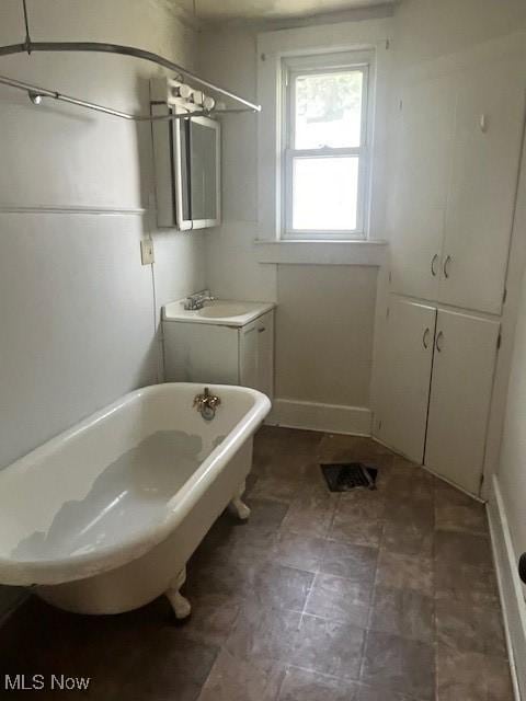 139 Chapman St, Zanesville, OH 43701 - bathroom with a freestanding tub and a sink