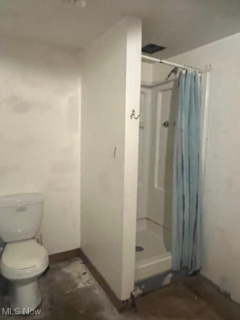 139 Chapman St, Zanesville, OH 43701 - bathroom with a shower stall, toilet, and baseboards