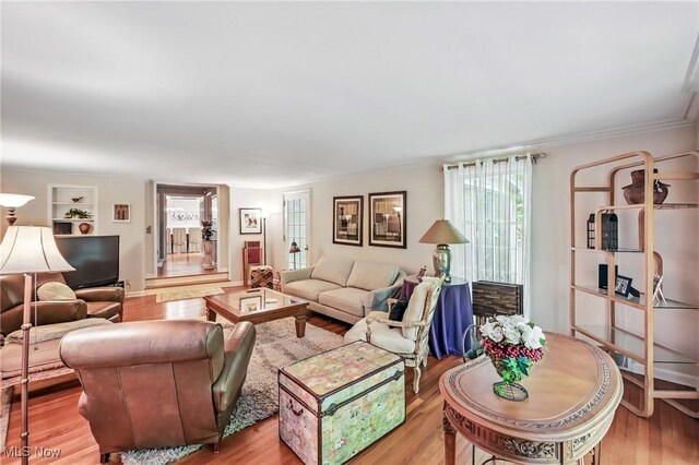 3711 Sampson Rd, Youngstown, OH 44505 - living room with wood finished floors, ornamental molding, and built in features