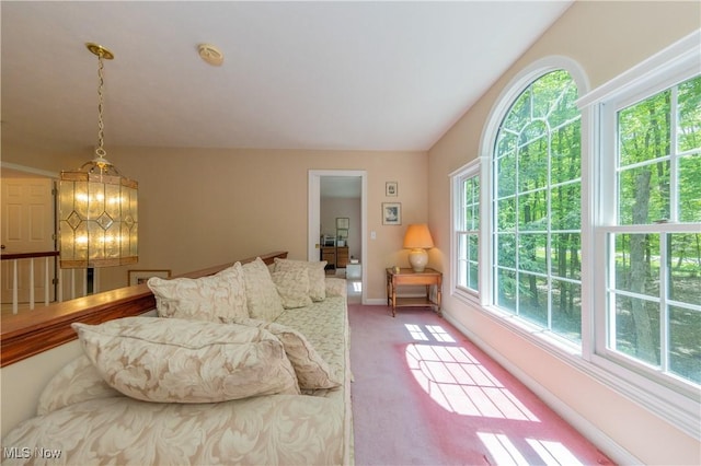 1030 Whisperwood Ln, Aurora, OH 44202 - living area featuring healthy amount of natural light, light colored carpet, and baseboards
