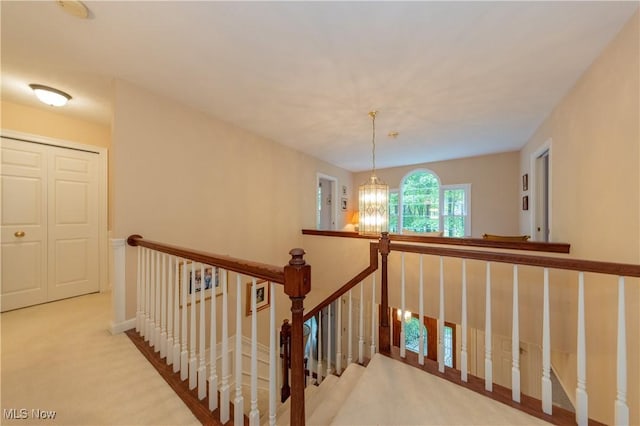 1030 Whisperwood Ln, Aurora, OH 44202 - stairway with carpet flooring and a chandelier