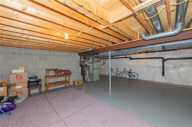 1030 Whisperwood Ln, Aurora, OH 44202 - unfinished basement featuring heating unit and concrete block wall