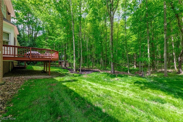 1030 Whisperwood Ln, Aurora, OH 44202 - view of green lawn featuring a wooden deck