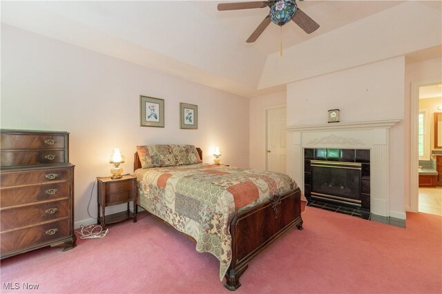 1030 Whisperwood Ln, Aurora, OH 44202 - carpeted bedroom with a tile fireplace, a ceiling fan, and baseboards