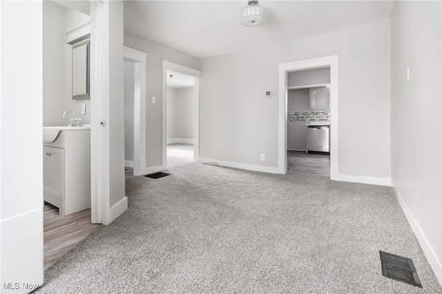 452 E Summit St, Alliance, OH 44601 - empty room featuring light colored carpet, baseboards, and a sink