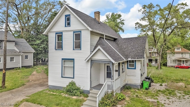 452 E Summit St, Alliance, OH 44601 - traditional-style home with roof with shingles and a chimney