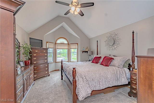 carpeted bedroom with vaulted ceiling, a ceiling fan, and baseboards