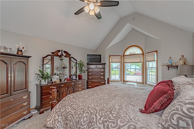carpeted bedroom featuring vaulted ceiling, a ceiling fan, and baseboards