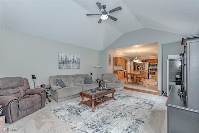 carpeted living room featuring lofted ceiling and ceiling fan