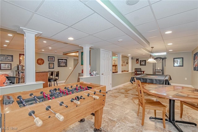 game room with decorative columns, a dry bar, recessed lighting, and baseboards