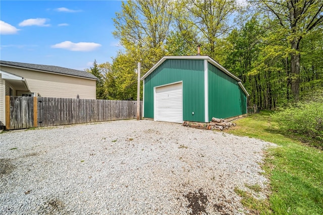 4946 Ireland Rd, Rome, OH 44085 - detached garage featuring fence and gravel driveway