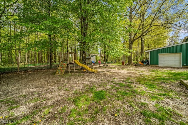 4946 Ireland Rd, Rome, OH 44085 - view of yard featuring a playground and a detached garage