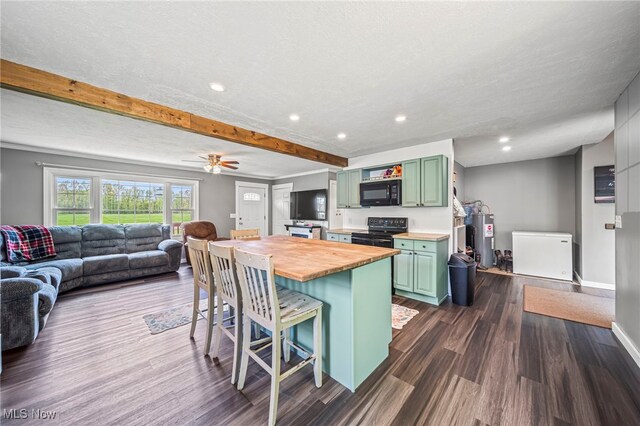 4946 Ireland Rd, Rome, OH 44085 - kitchen featuring green cabinets, butcher block counters, black appliances, water heater, and a kitchen bar