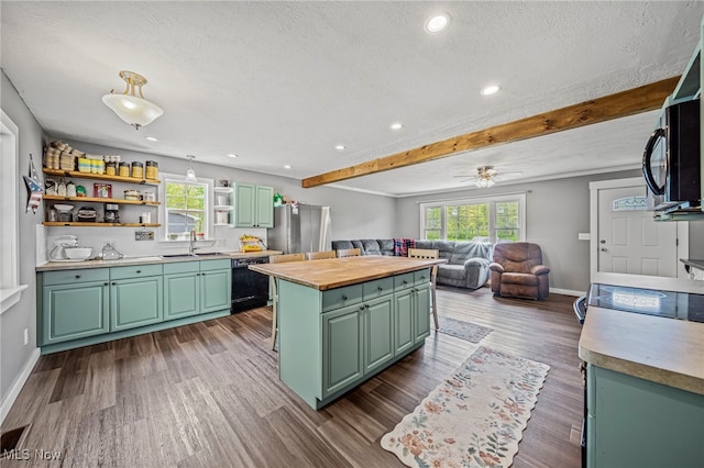4946 Ireland Rd, Rome, OH 44085 - kitchen with green cabinets, dishwasher, a sink, open shelves, and a kitchen island