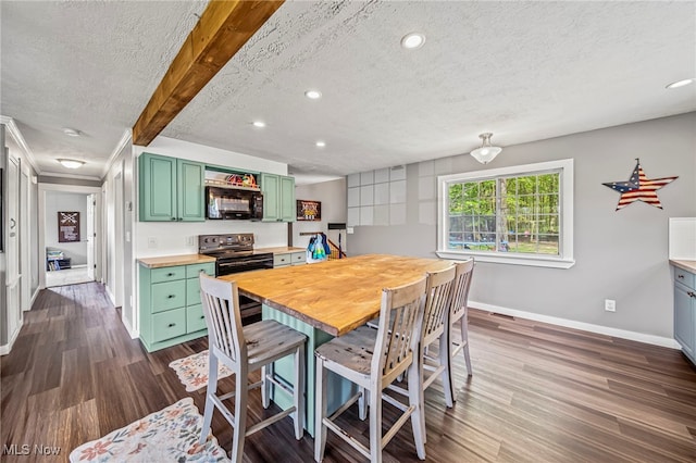4946 Ireland Rd, Rome, OH 44085 - dining space featuring a textured ceiling, baseboards, recessed lighting, and dark wood finished floors