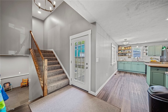 4946 Ireland Rd, Rome, OH 44085 - foyer entrance with a chandelier, wood finished floors, stairway, baseboards, and recessed lighting