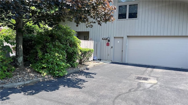 250 Laurel Cir Unit 13, Aurora, OH 44202 - garage featuring asphalt driveway