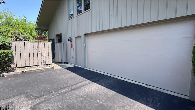 250 Laurel Cir Unit 13, Aurora, OH 44202 - garage with asphalt driveway