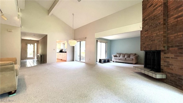 250 Laurel Cir Unit 13, Aurora, OH 44202 - living area with carpet, healthy amount of natural light, a brick fireplace, high vaulted ceiling, and beam ceiling