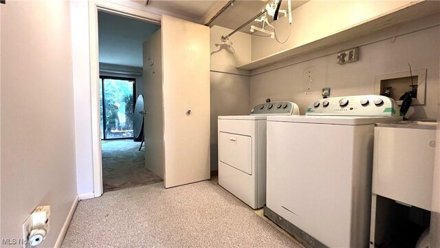 250 Laurel Cir Unit 13, Aurora, OH 44202 - laundry room featuring washer and clothes dryer and light carpet