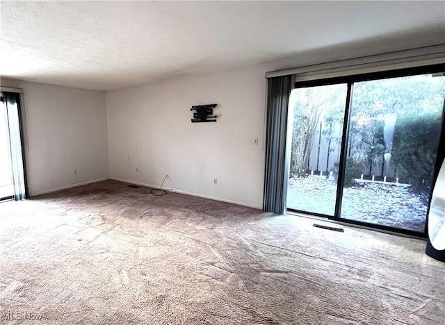 250 Laurel Cir Unit 13, Aurora, OH 44202 - carpeted empty room with plenty of natural light