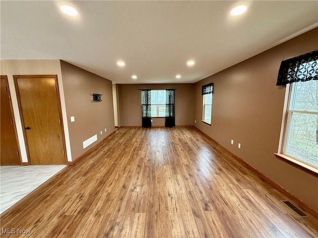 36 Choctaw Trl, Malvern, OH 44644 - unfurnished room with light wood finished floors, recessed lighting, and baseboards