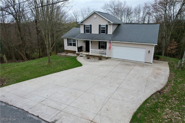 36 Choctaw Trl, Malvern, OH 44644 - traditional home with a porch, concrete driveway, a garage, and a front yard