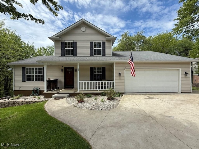 36 Choctaw Trl, Malvern, OH 44644 - view of front of home with a porch, driveway, and an attached garage