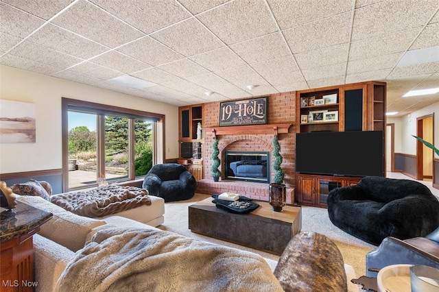 7384 Braucher St NW, North Canton, OH 44720 - living room featuring a brick fireplace and a drop ceiling