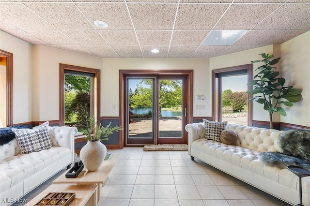 7384 Braucher St NW, North Canton, OH 44720 - living area featuring light tile patterned floors, recessed lighting, and wainscoting