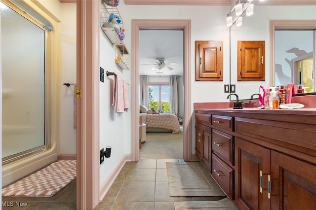 7384 Braucher St NW, North Canton, OH 44720 - ensuite bathroom with a shower with door, a ceiling fan, vanity, tile patterned floors, and baseboards