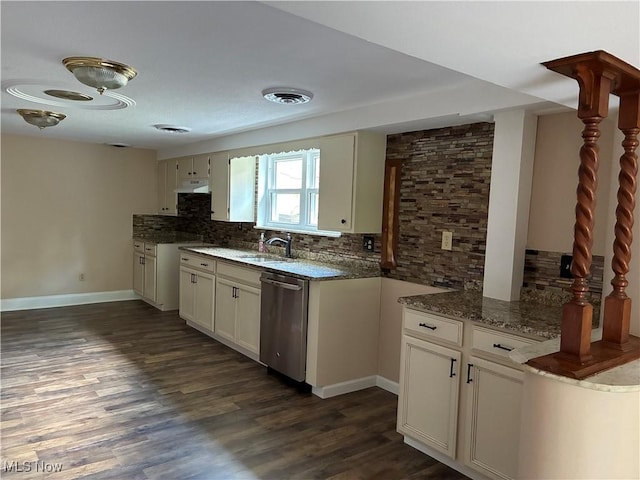 260 Miller Ave, Weirton, WV 26062 - kitchen with stainless steel dishwasher, backsplash, dark stone countertops, a sink, and baseboards