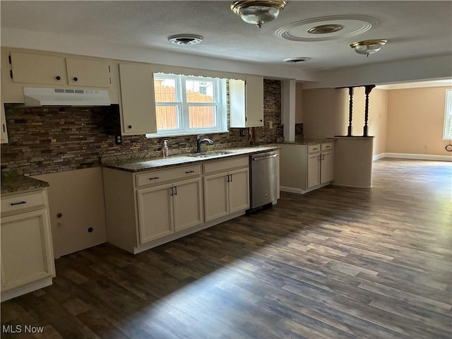 260 Miller Ave, Weirton, WV 26062 - kitchen featuring under cabinet range hood, stainless steel dishwasher, a sink, tasteful backsplash, and plenty of natural light