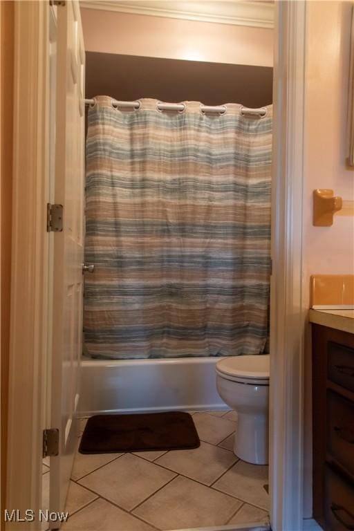 7969 Bricker Rd NW, Massillon, OH 44646 - full bathroom featuring shower / bathtub combination with curtain, tile patterned floors, toilet, and vanity