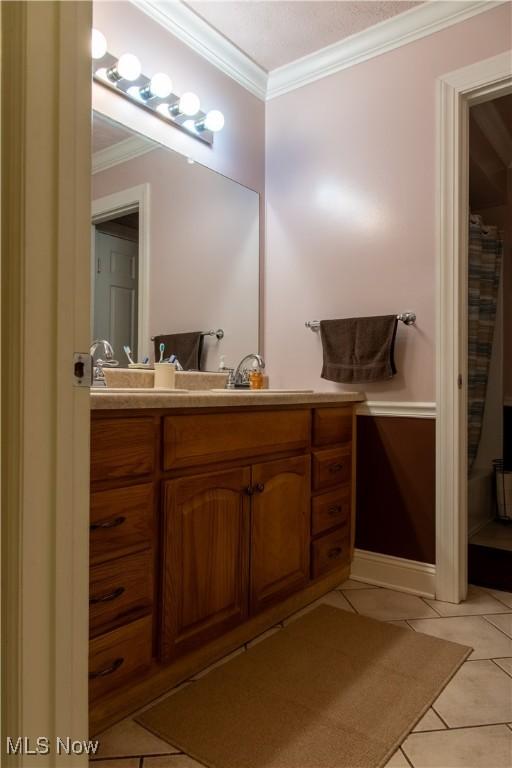 7969 Bricker Rd NW, Massillon, OH 44646 - full bathroom featuring tile patterned flooring, ornamental molding, and vanity