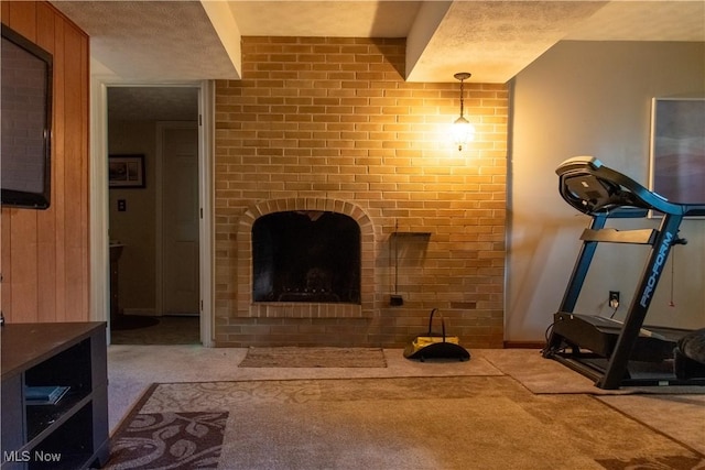7969 Bricker Rd NW, Massillon, OH 44646 - unfurnished living room with carpet flooring and a fireplace