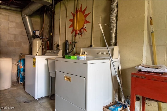 7969 Bricker Rd NW, Massillon, OH 44646 - washroom featuring separate washer and dryer and concrete block wall