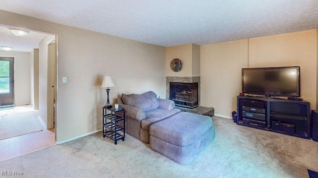 10219 Spinnaker Run, Aurora, OH 44202 - carpeted living area with a fireplace with raised hearth, baseboards, and a textured ceiling