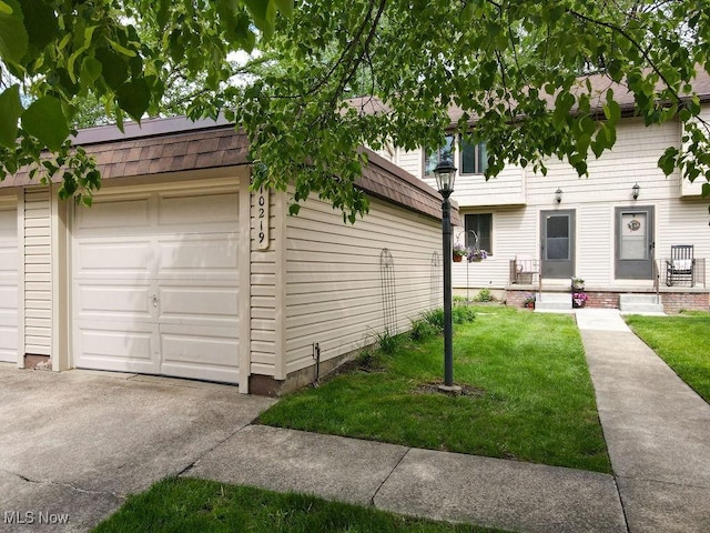 10219 Spinnaker Run, Aurora, OH 44202 - view of front of home with a front yard, a shingled roof, and driveway