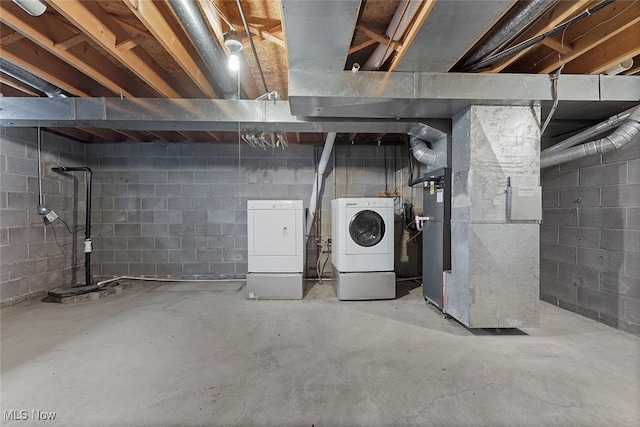 67 Chestnut Ave, Northfield, OH 44067 - unfinished below grade area featuring separate washer and dryer, heating unit, and drainage system