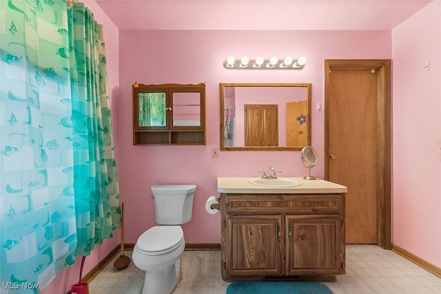 67 Chestnut Ave, Northfield, OH 44067 - bathroom with tile patterned floors, a shower with curtain, toilet, vanity, and baseboards